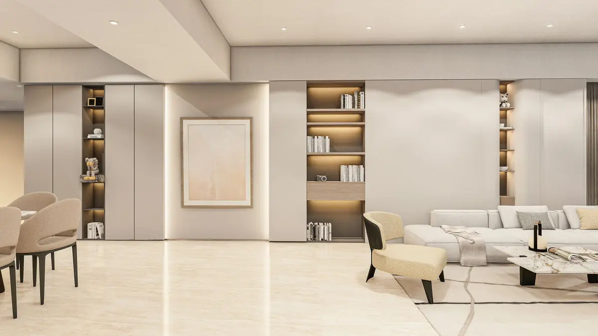 Living room with built-in display shelving, a pale sofa and marble flooring