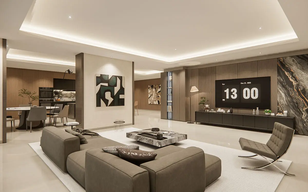 Living room with a grey sectional sofa, marble feature wall and open-plan kitchen behind