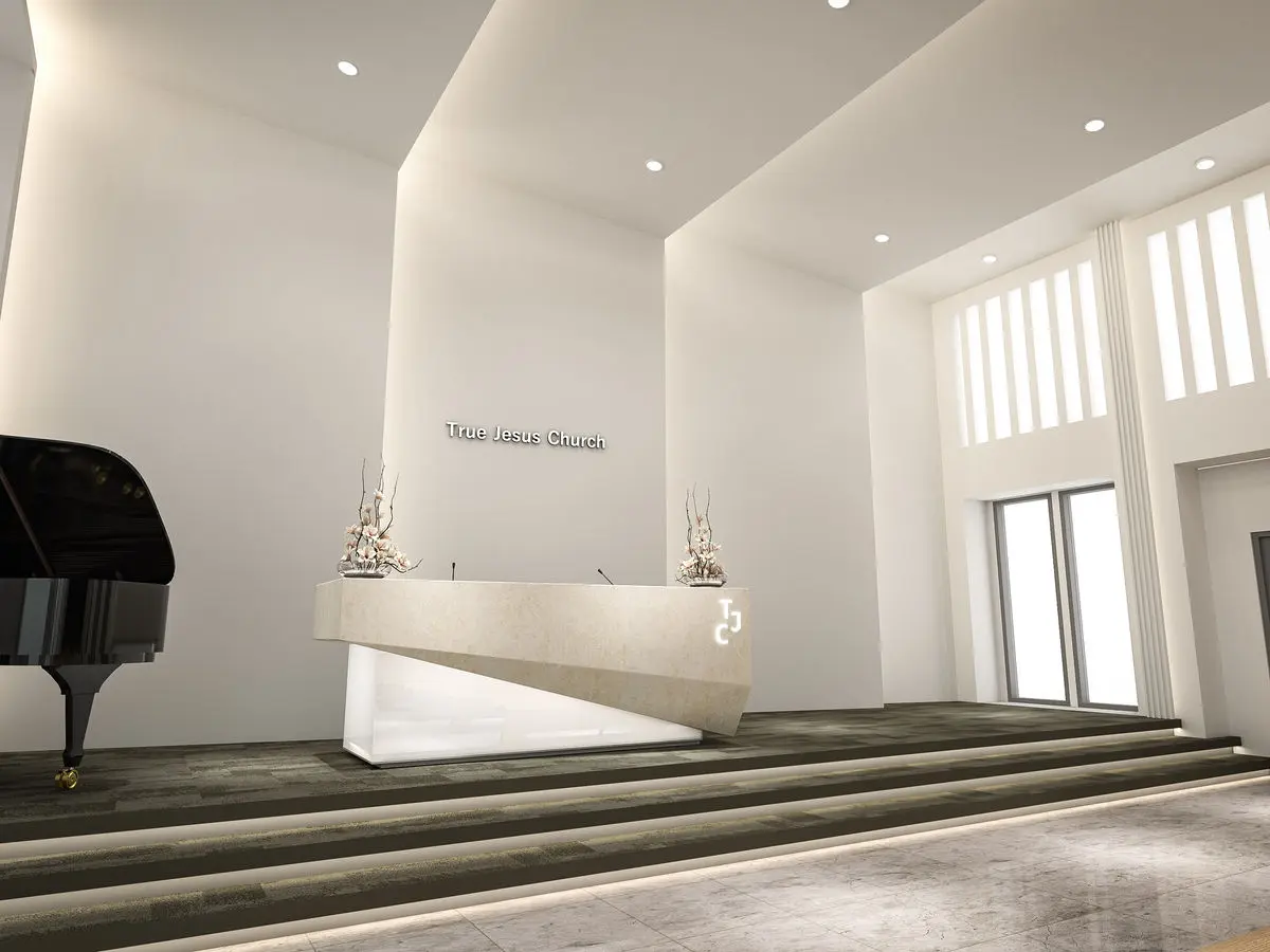 Church hall with a raised stone platform, grand piano and clerestory windows