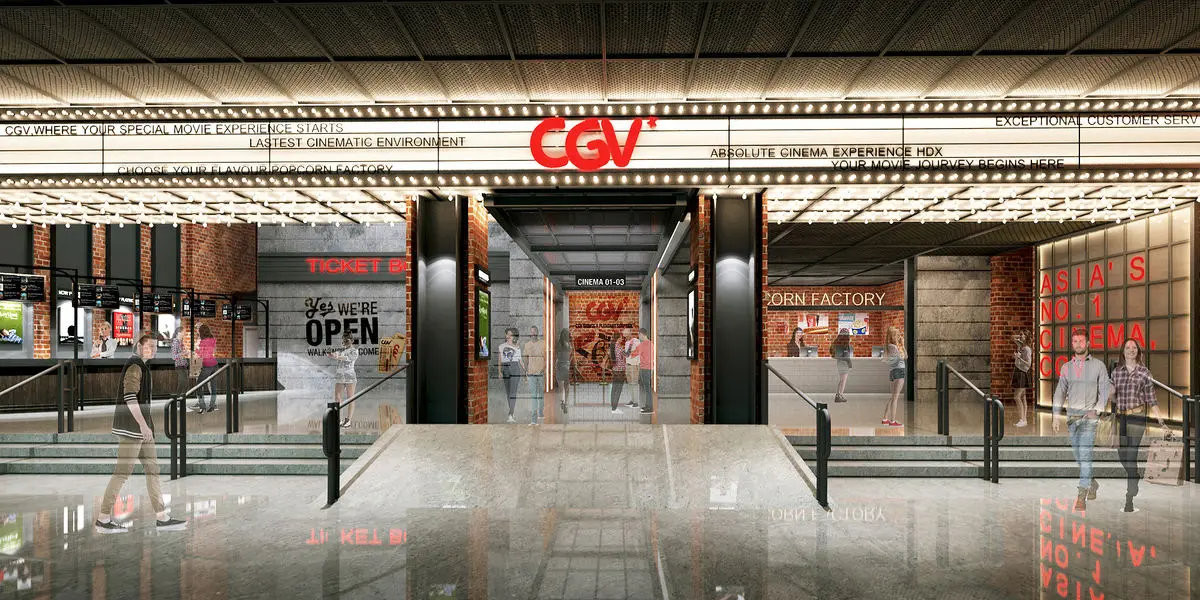 Cinema entrance with a marquee-style canopy and red brand signage