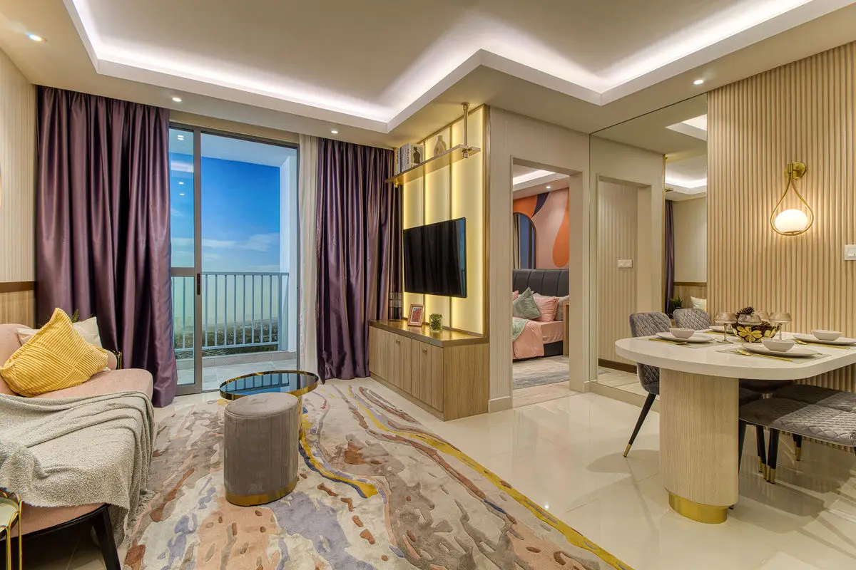 Living and dining area with purple curtains, mirrored wall and marbled rug