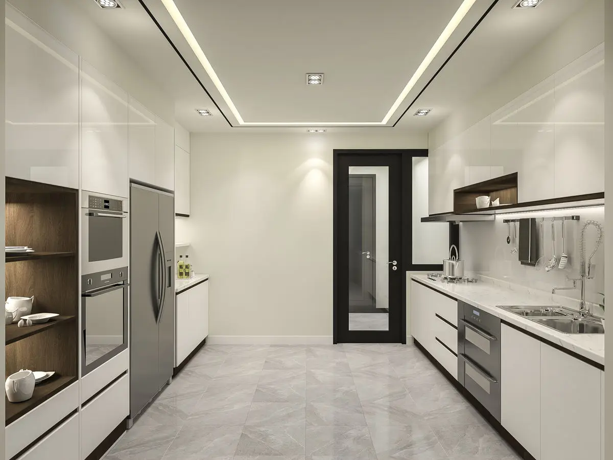 Galley kitchen with white and timber cabinetry, built-in ovens and a glazed door