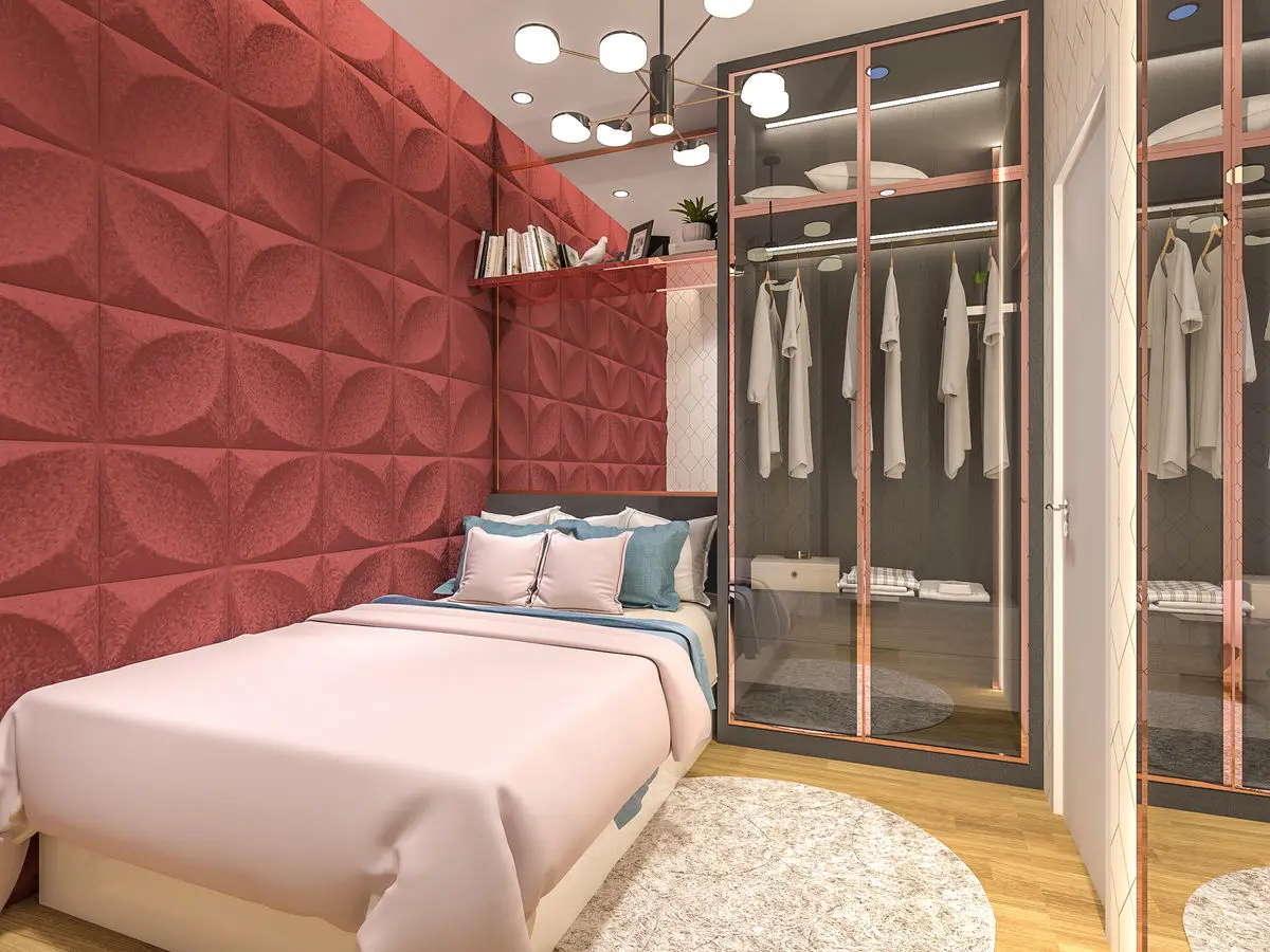 Bedroom with a red textured feature wall, mirrored wardrobe and pink bedding