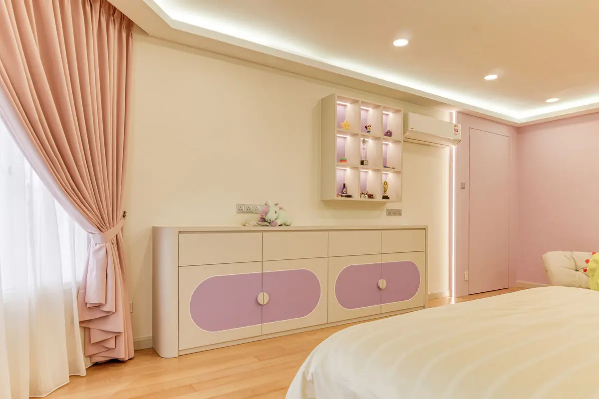 Bedroom with a pink and cream sideboard, backlit display cubbies and full-height curtains