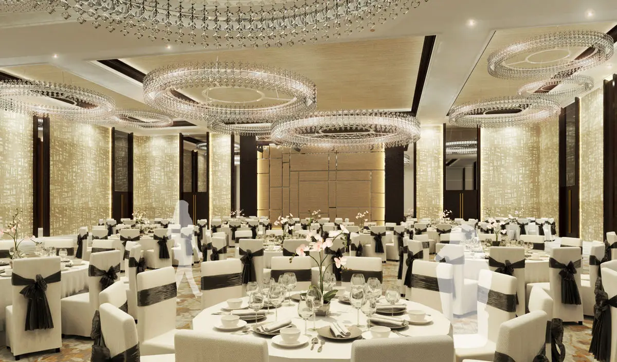 Ballroom set for a banquet with round tables and layered crystal chandeliers