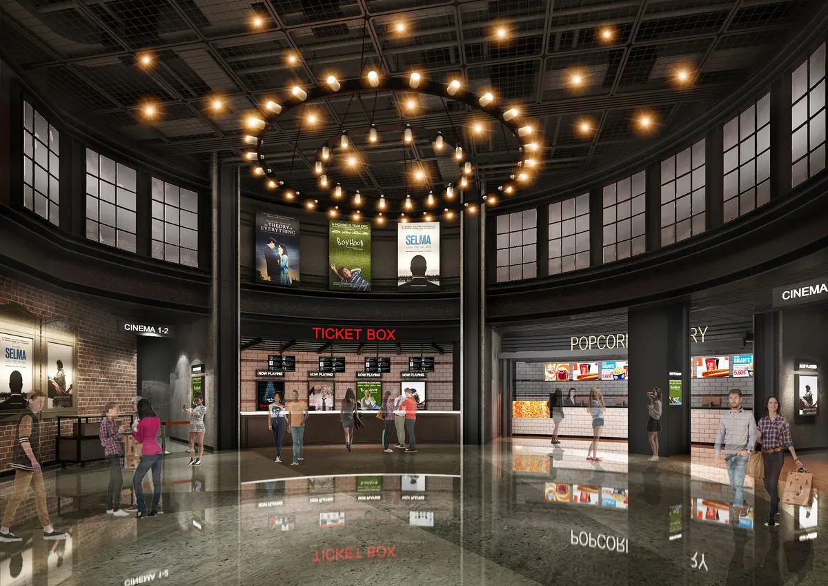 Cinema lobby with a ring chandelier, ticket counter and concession stand