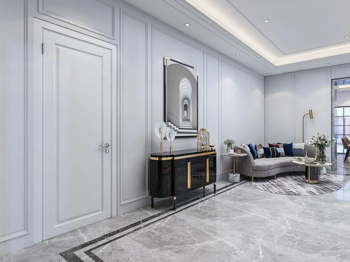 Panelled hallway with a black and gold console table, framed artwork and marble flooring