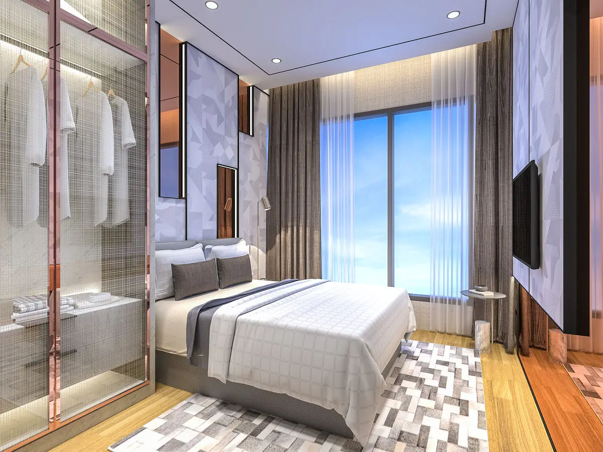 Bedroom with a glass-fronted wardrobe, marble headboard panel and a patterned rug