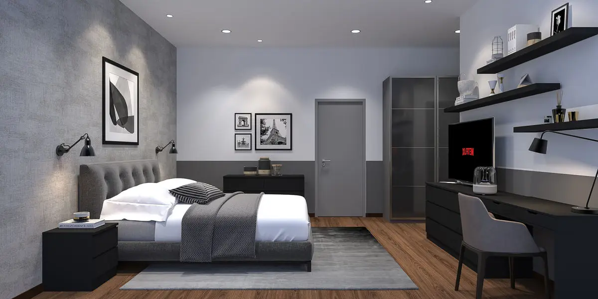 Bedroom with a tufted headboard, concrete-look wall, floating shelves and a desk