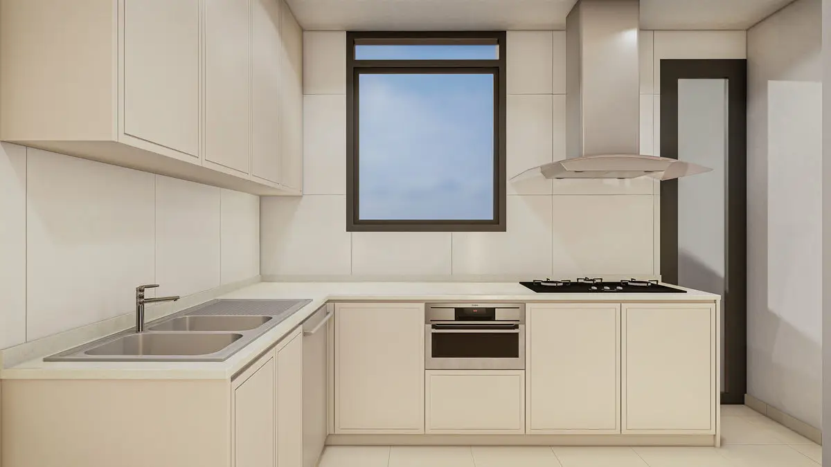Kitchen with cream cabinets, a stainless hood, hob and window above the sink