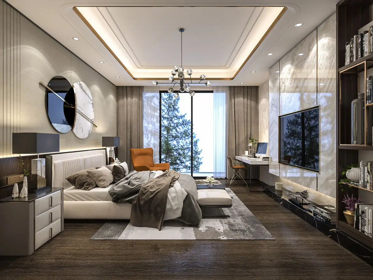 Bedroom with a padded headboard wall, wall-mounted TV and a study desk beside the window