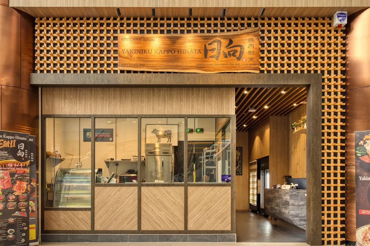 Restaurant shopfront with timber lattice framing and a hanging signboard