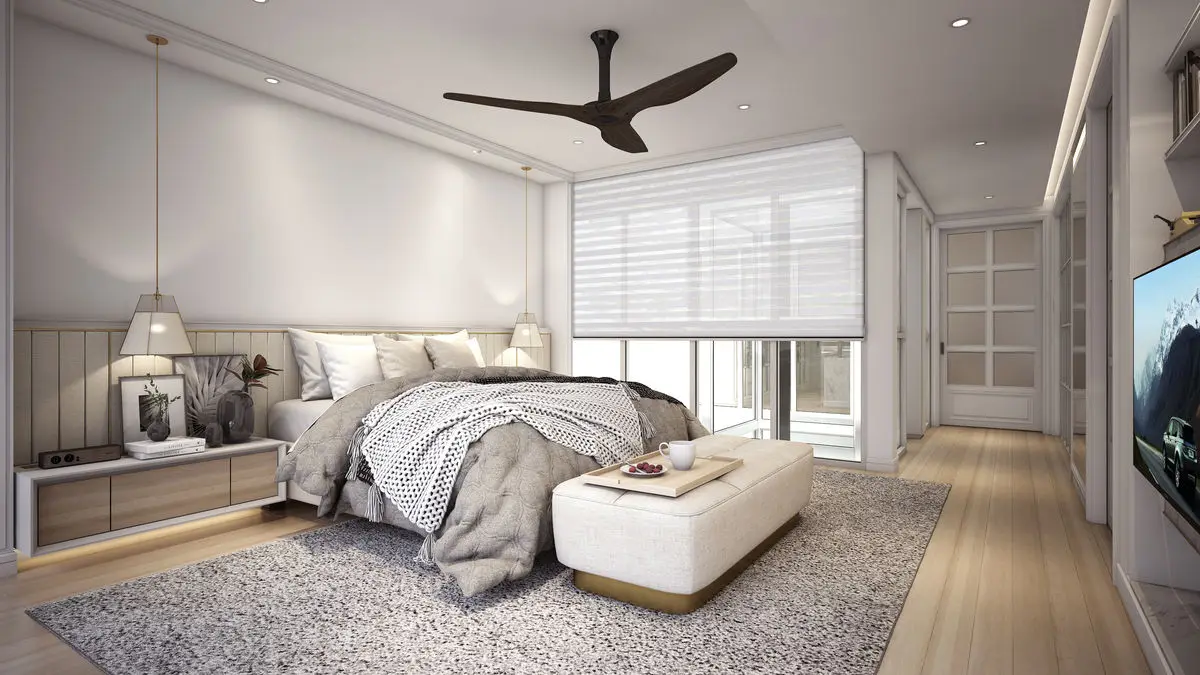 Bedroom with a padded headboard, wall-mounted TV and a bench at the foot of the bed