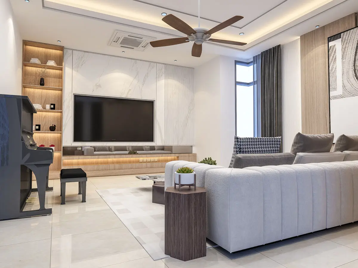 Living room with a marble TV feature wall, long timber console, grey sectional sofa and an arcade cabinet