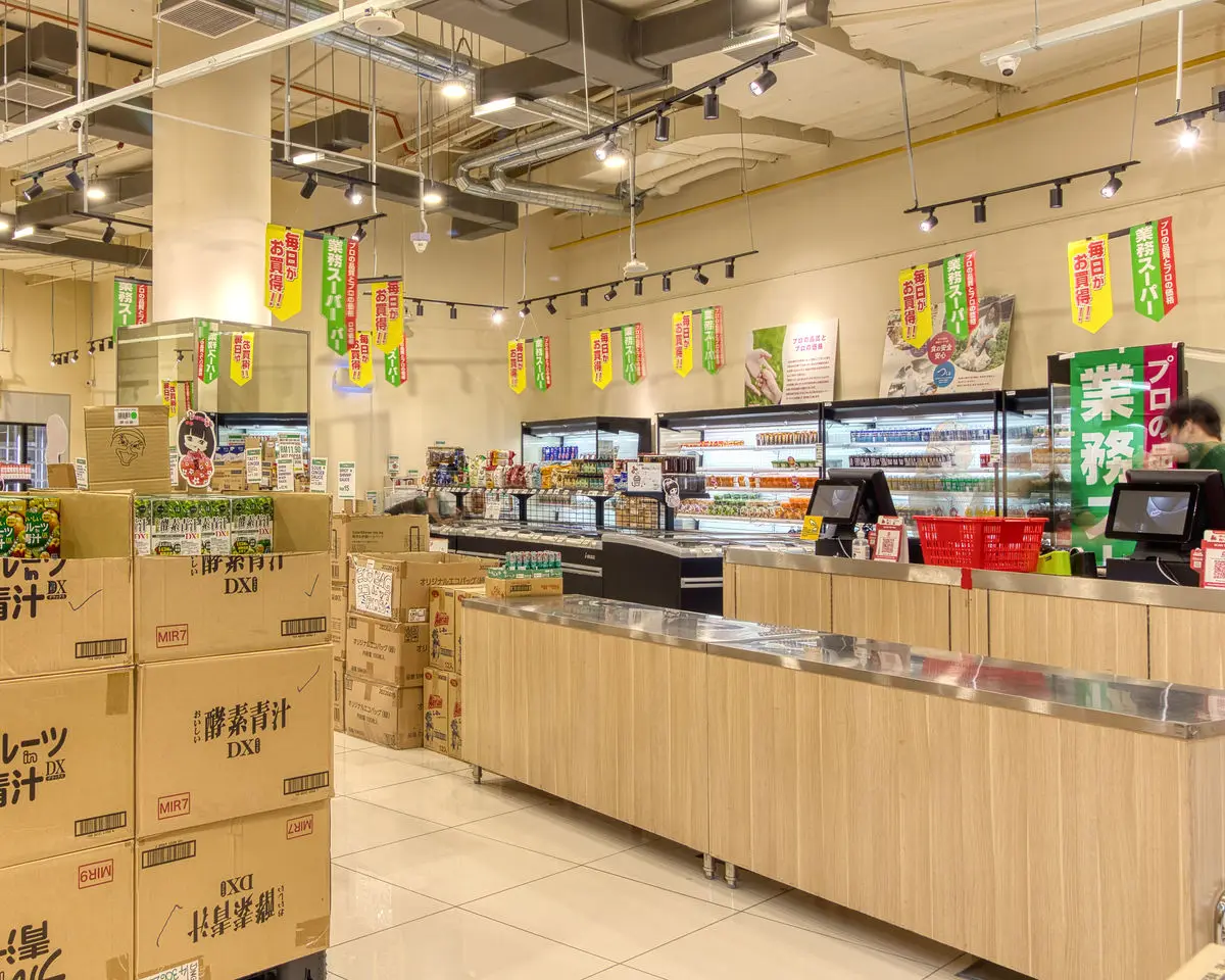 Store interior with timber service counters, chillers and promotional banners