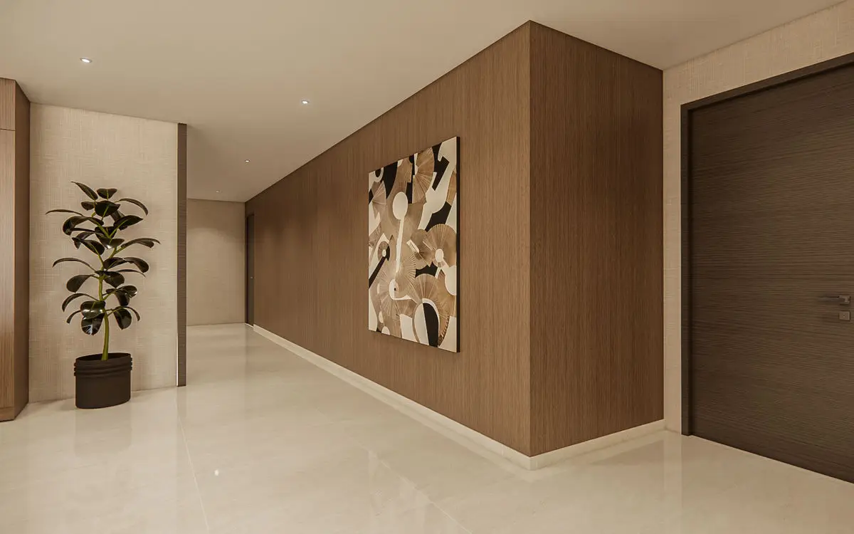Corridor with timber wall panelling, framed artwork and a potted plant