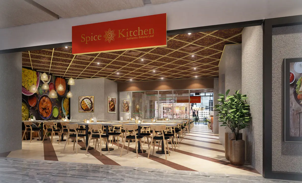 Mall restaurant frontage with red signage and a slatted timber ceiling