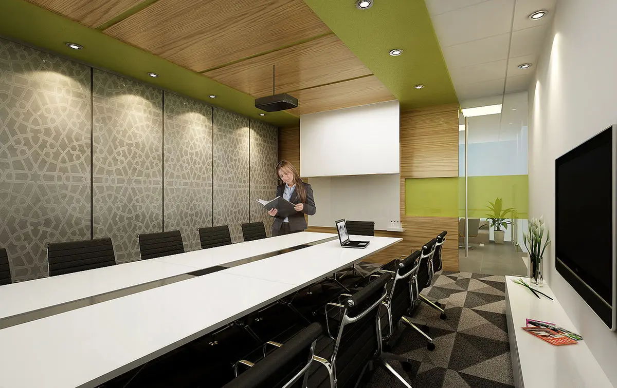 Boardroom with a long white table, green ceiling panel and textured wall finish