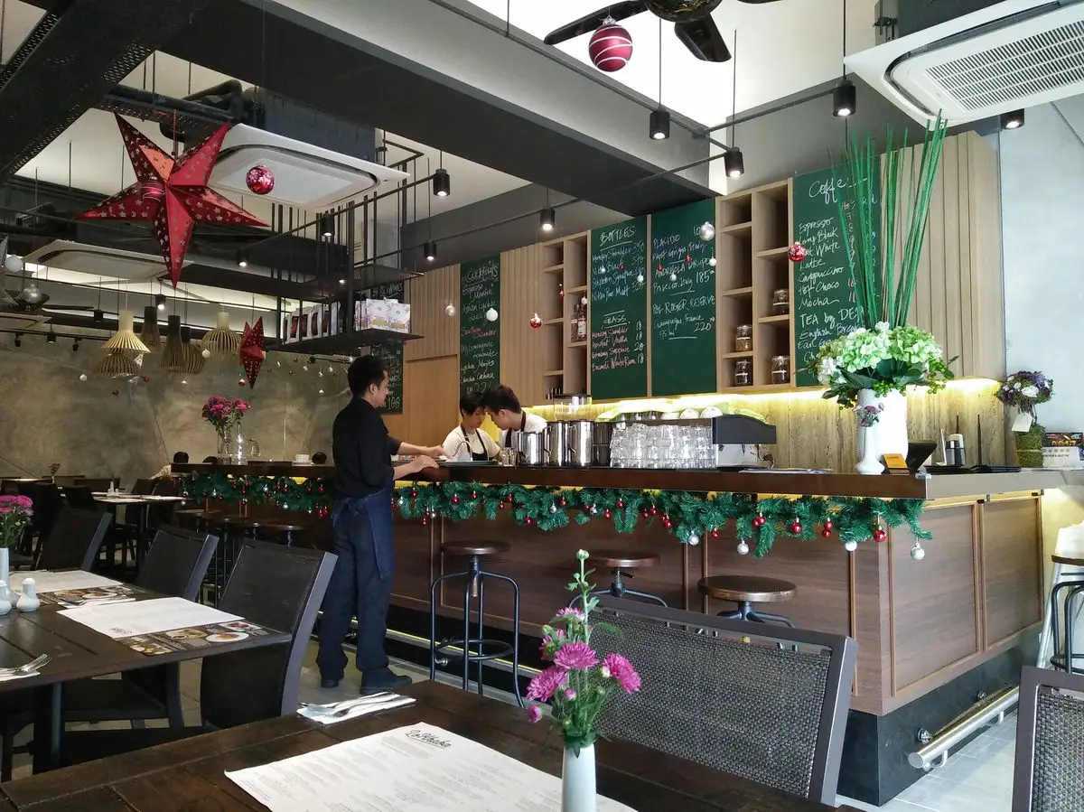 Service counter with a chalkboard menu wall and pendant lighting