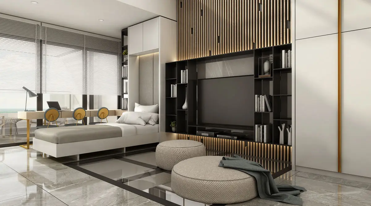 Bedroom with a slatted timber wall, wall-mounted TV and a rounded bench seat