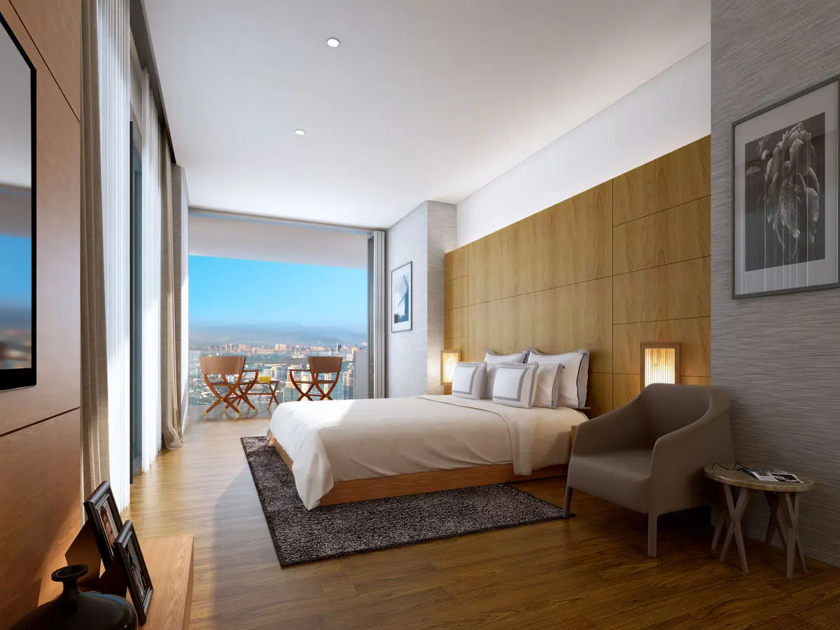 Bedroom with a padded timber feature wall, city view and a lounge chair by the window