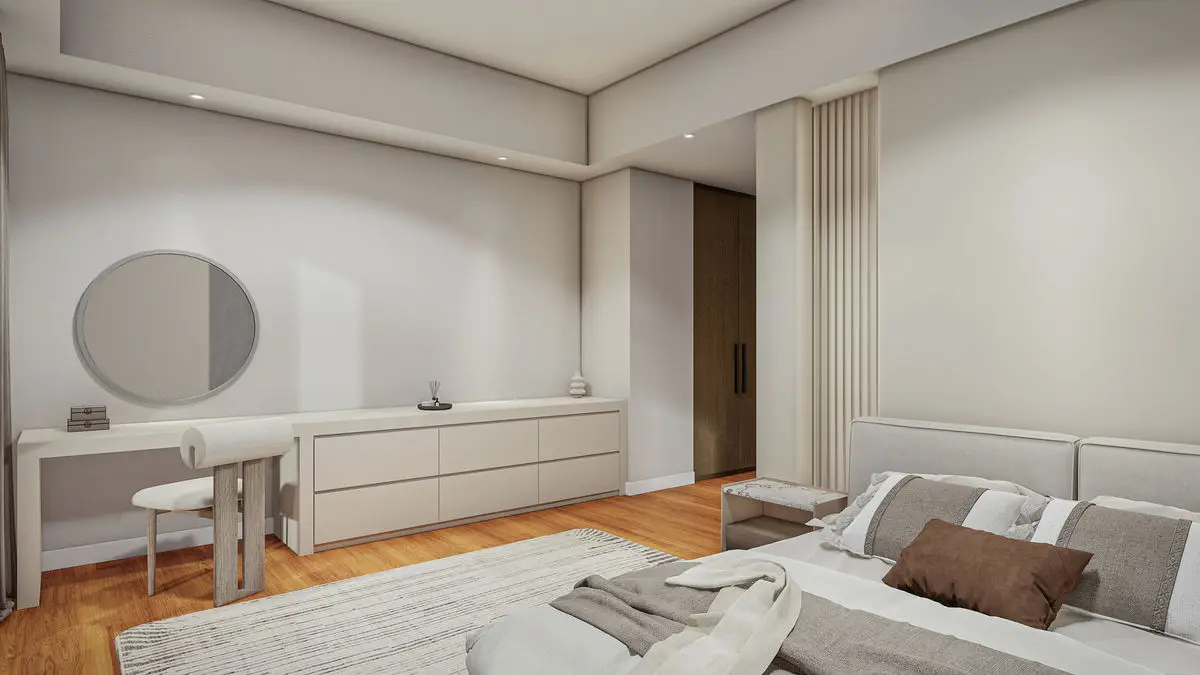 Bedroom with a dressing counter, round mirror and a fluted wall detail