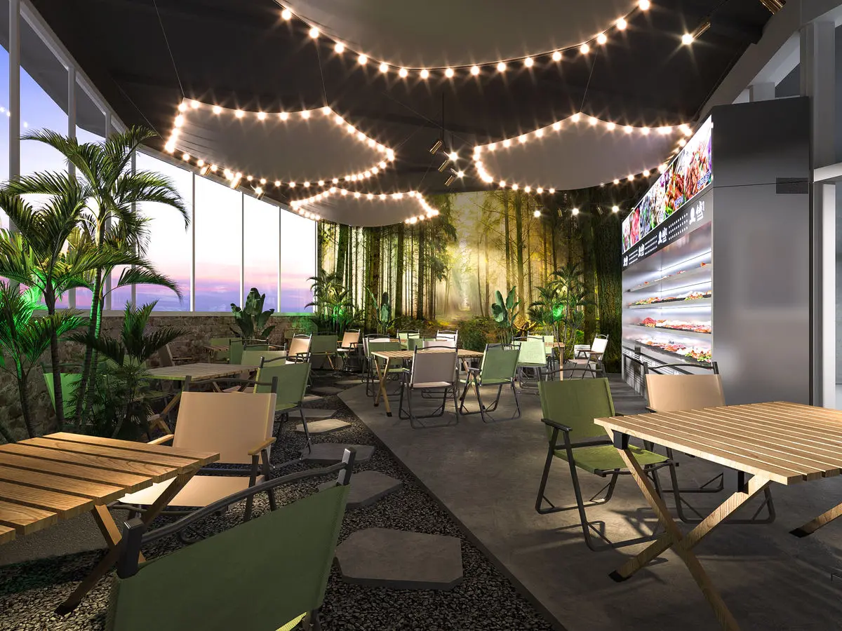 Terrace-style dining area with planting, festoon lights and folding chairs