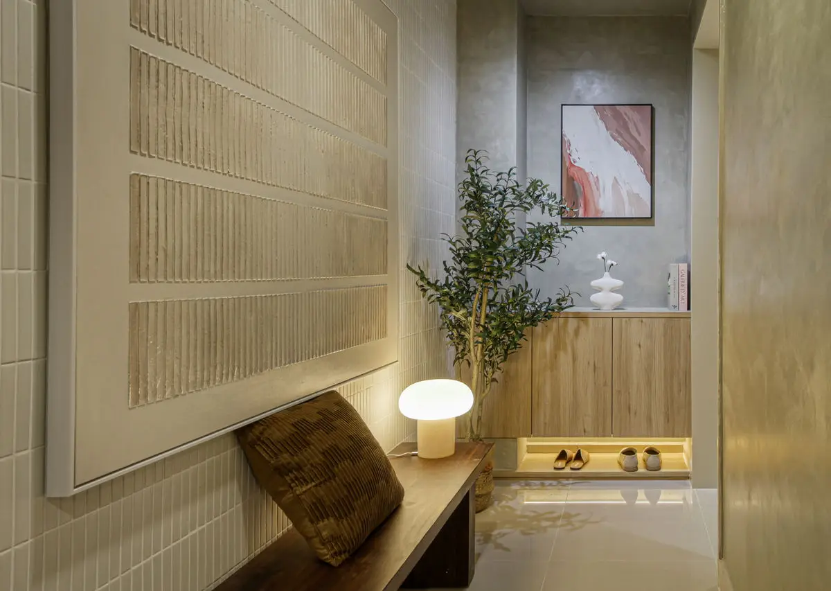 Entrance with a reeded timber panel, bench seat and recessed shoe storage