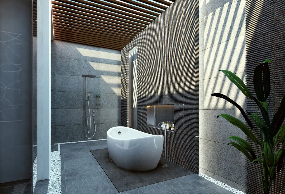 Outdoor-style bathroom with a freestanding tub, stone walls and planting