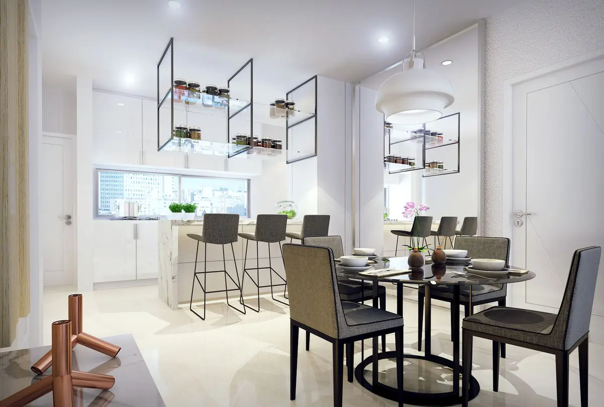 Kitchen counter with bar stools, a dining table and metal-framed display shelves