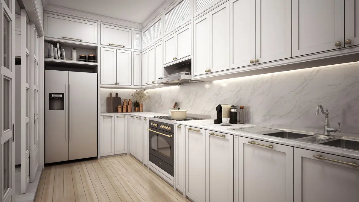 Kitchen with cream shaker cabinets, marble splashback and integrated appliances