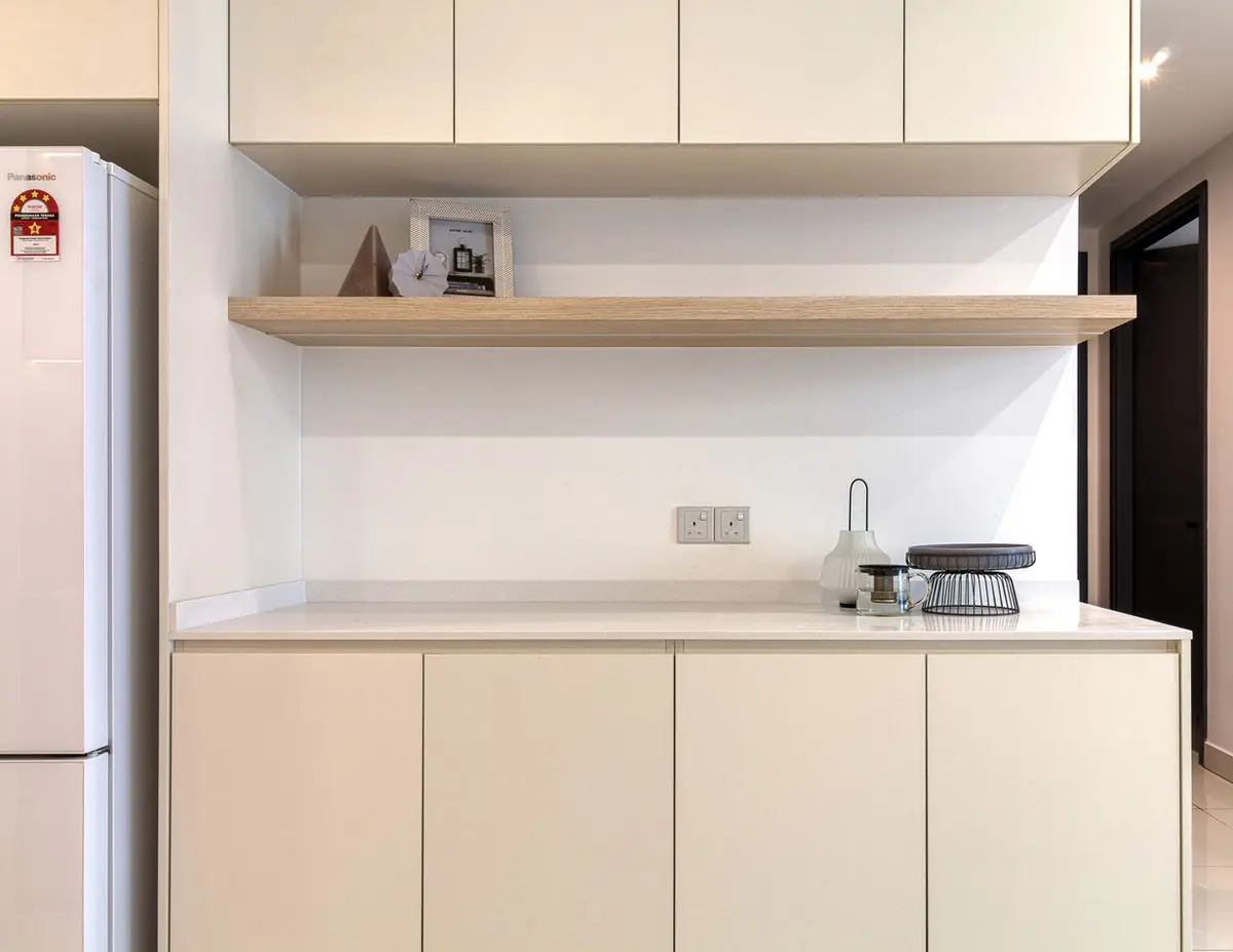 Dry kitchen counter with a floating timber shelf and full-height cabinets