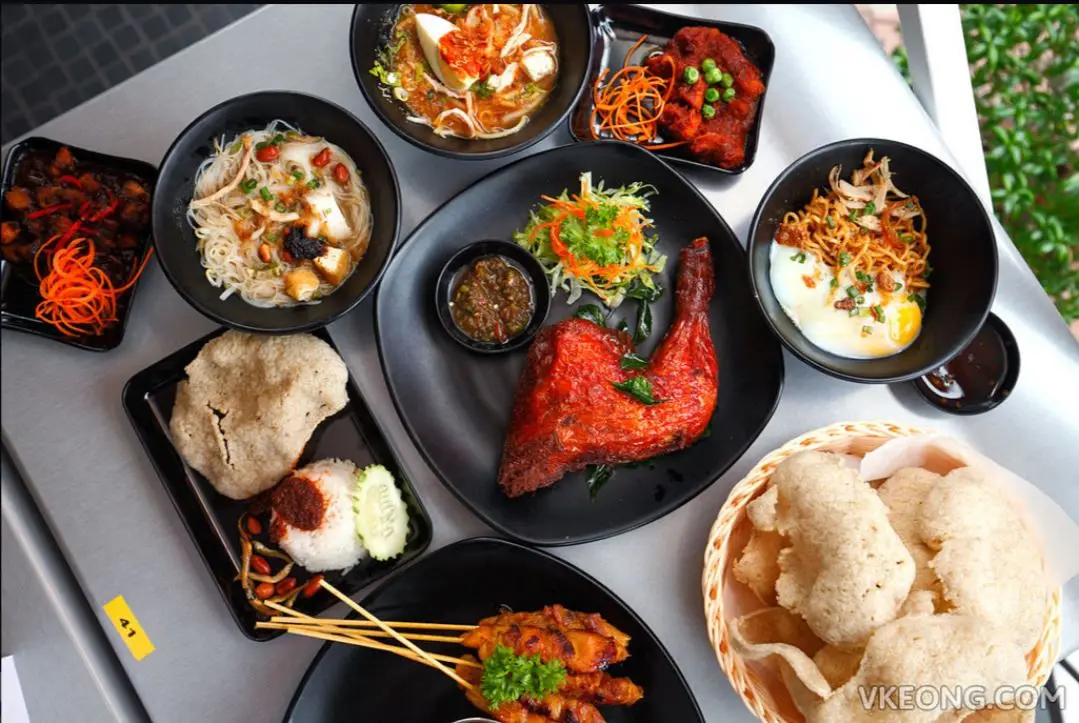 Overhead shot of several rice and noodle dishes on a table