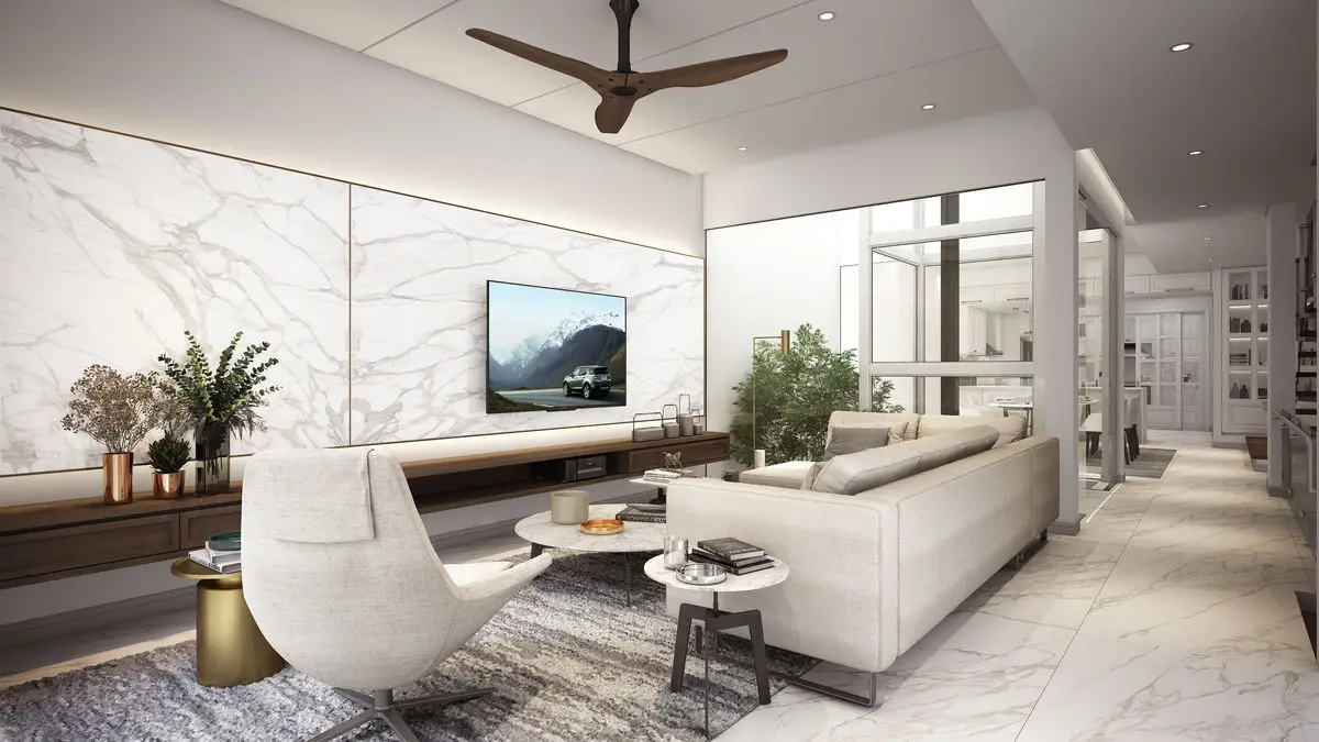 Living room with a marble feature wall, floating console and curved armchair
