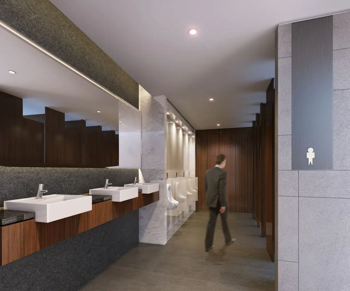 Washroom with a long vanity counter, terrazzo flooring and timber cubicles