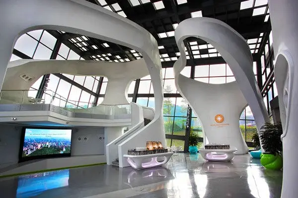 Exhibition area with a wall screen, model displays and moulded seating