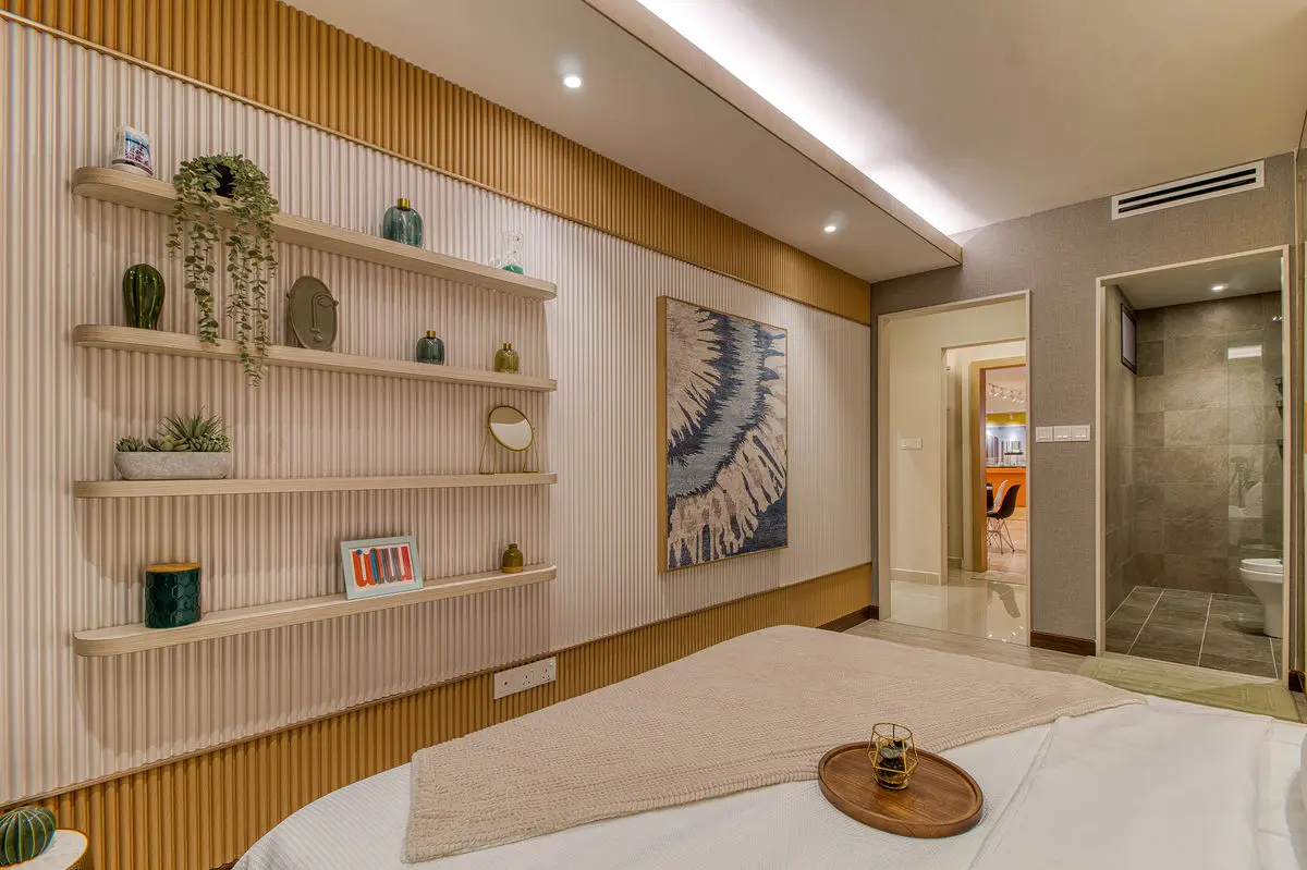 Bedroom with open timber shelving, fluted wall panelling and an ensuite doorway