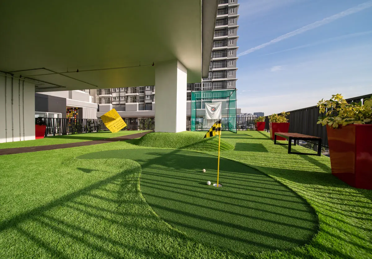 Rooftop putting green with planters, benches and tower views