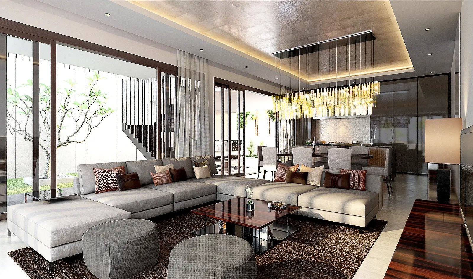 Open-plan living area in a Selangor landed home opening onto a landscaped courtyard tree