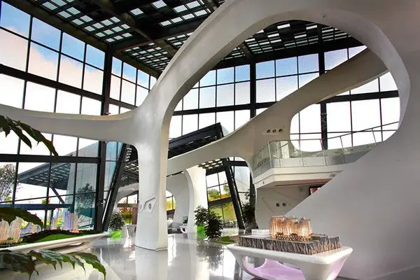 Atrium with sculptural forms, planting and a display plinth