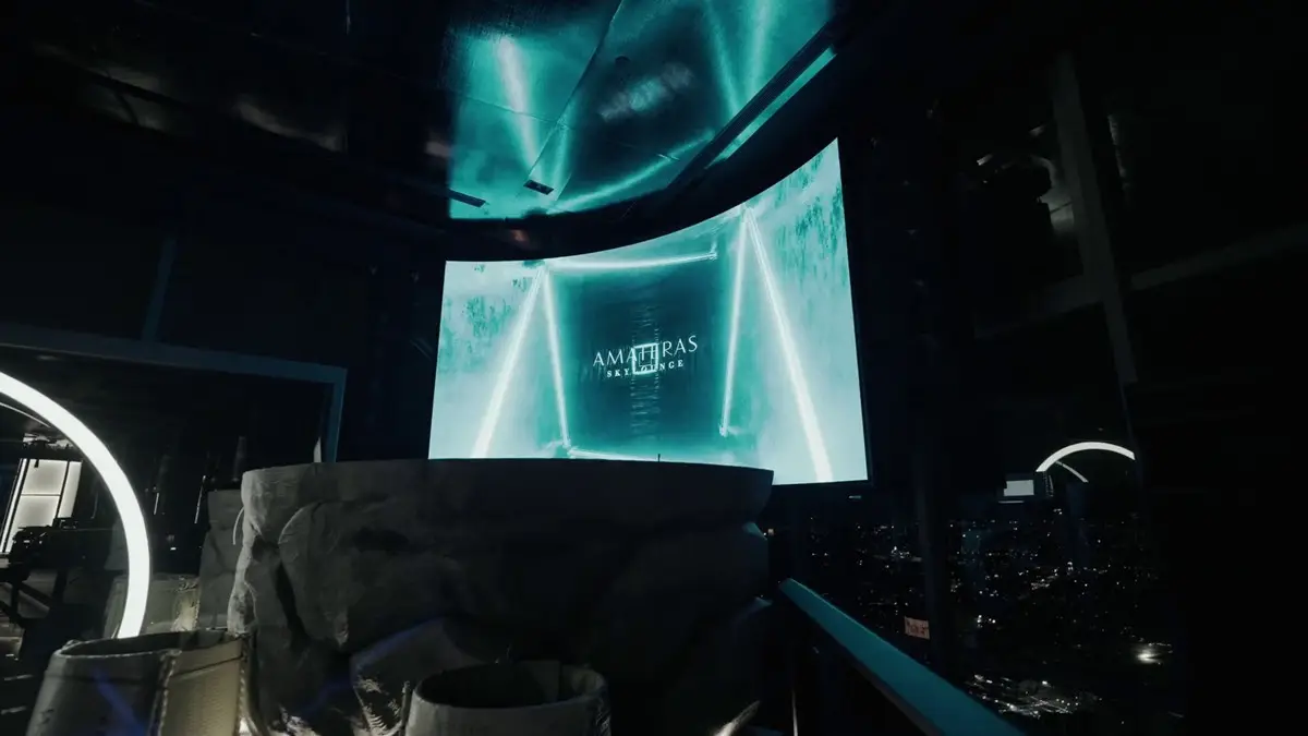 Lounge with an LED screen wall, ring light installation and city view