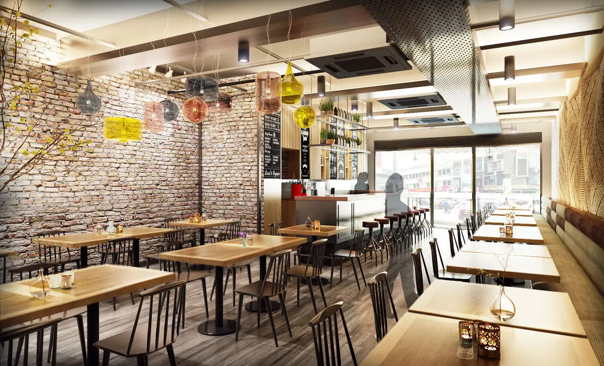 Dining area with exposed brick walls, timber tables and pendant lights