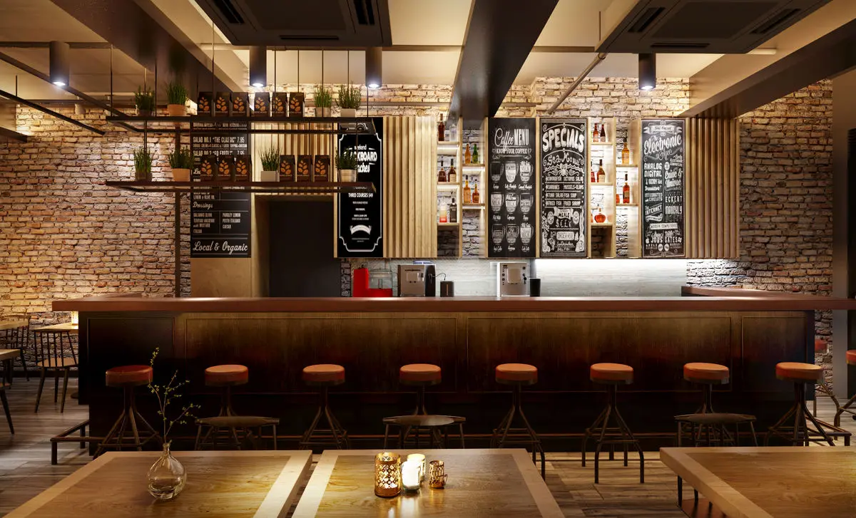 Bar counter with stools, bottle shelving and blackboard menus