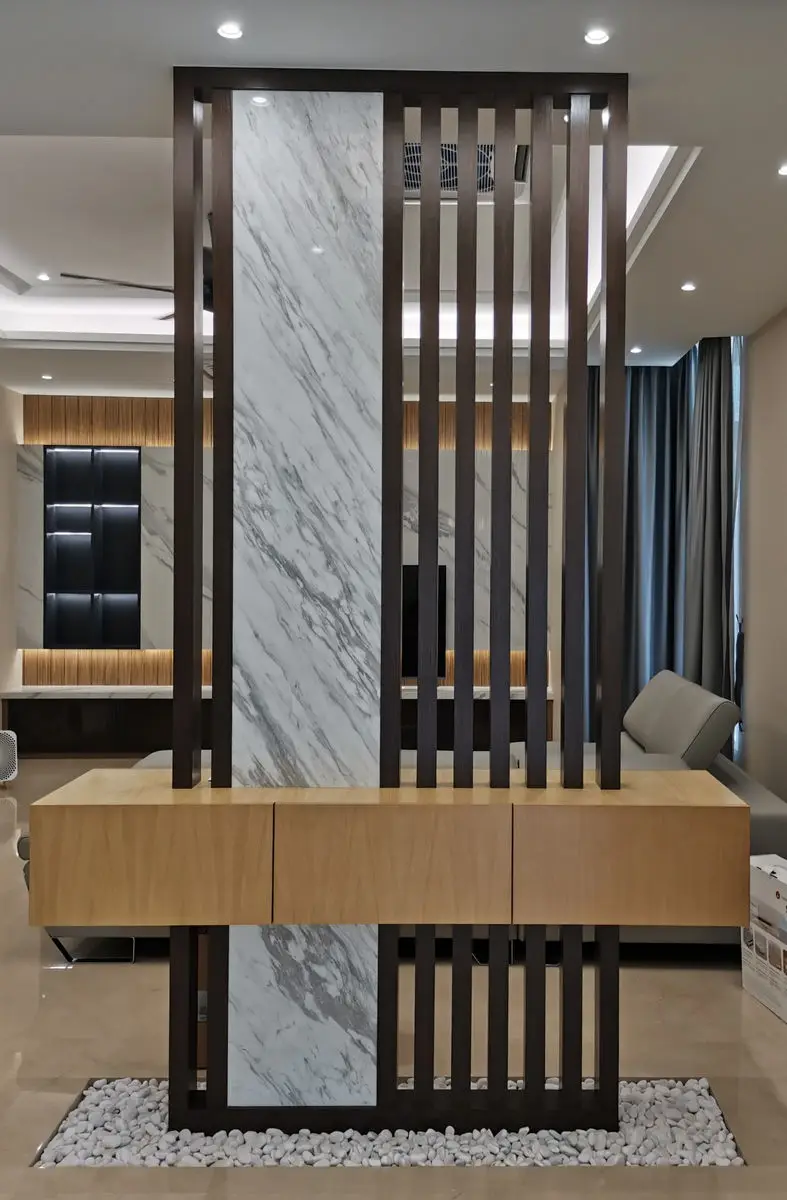 Entrance console in marble and timber, set against a slatted screen divider