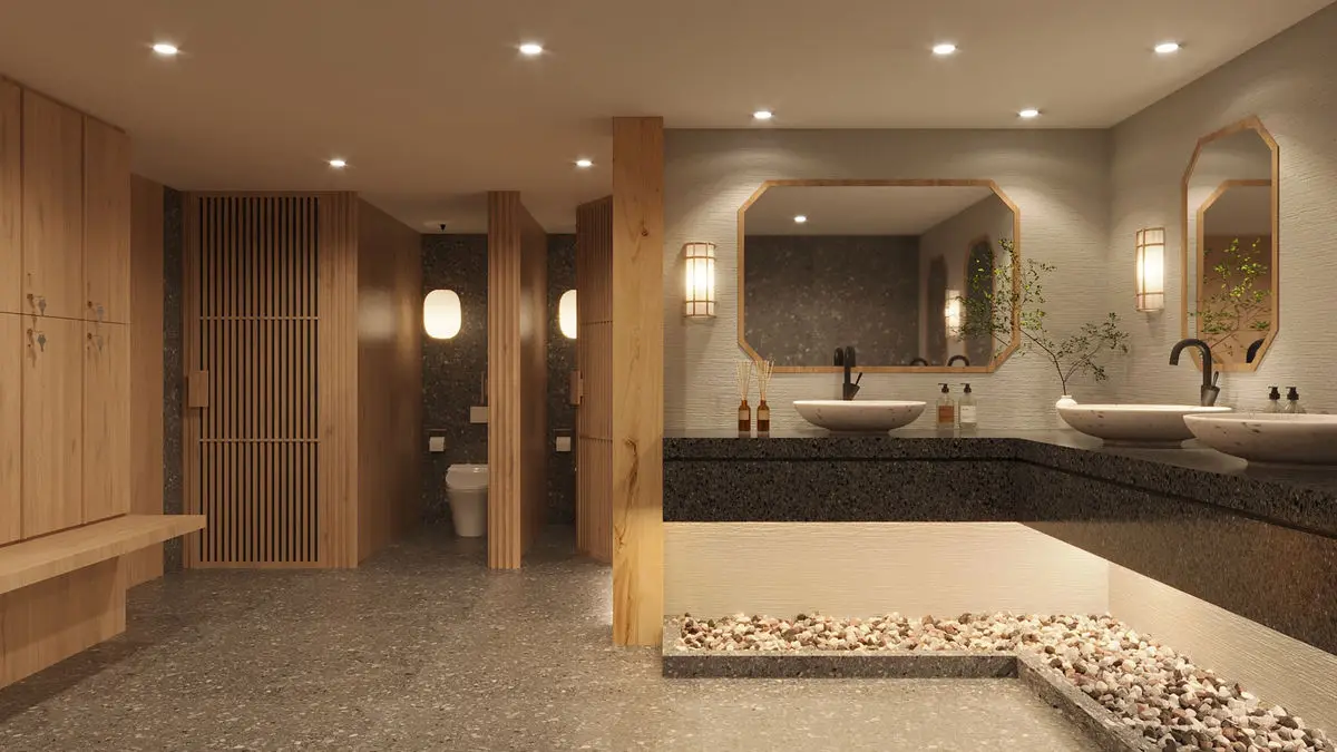Washroom with twin basins, timber cabinetry and a pebble-filled recess