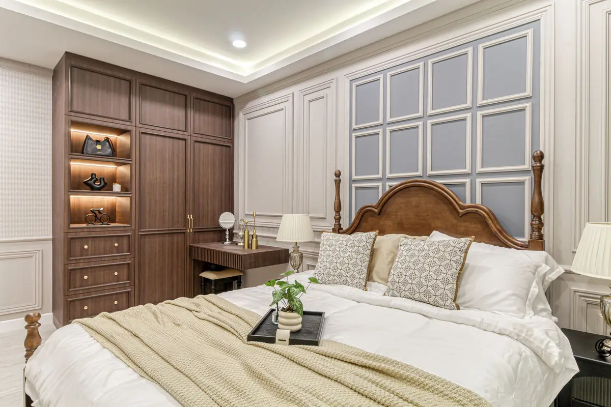 Bedroom with a timber bed, built-in wardrobe and a fitted dressing counter