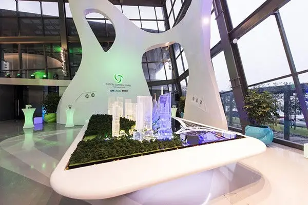 Scale model of a township on a curved white display table