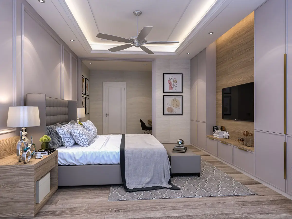 Bedroom with a grey upholstered headboard, timber TV wall and patterned rug
