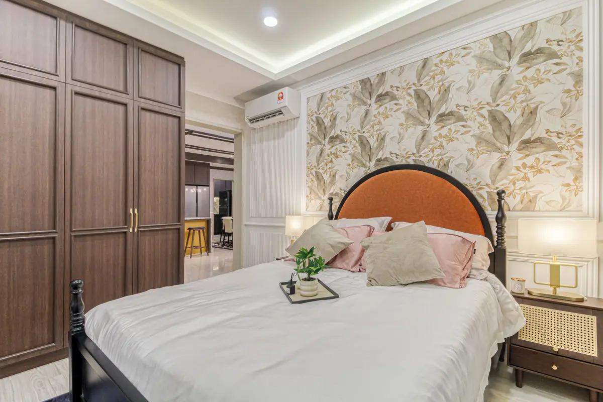 Bedroom with timber wardrobes, botanical wallpaper and an arched headboard