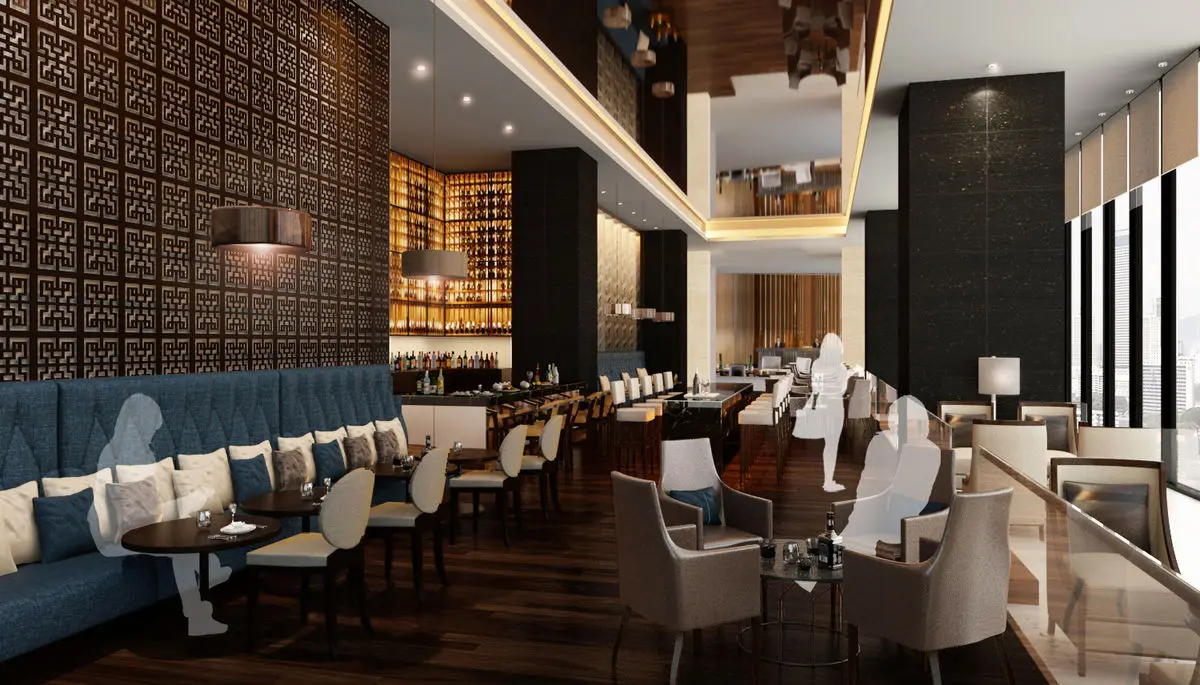 Hotel bar and lounge with blue banquettes, high stools and a patterned screen wall
